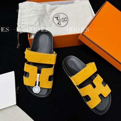 Hermès Chypre Sandals in a vibrant yellow shade,
