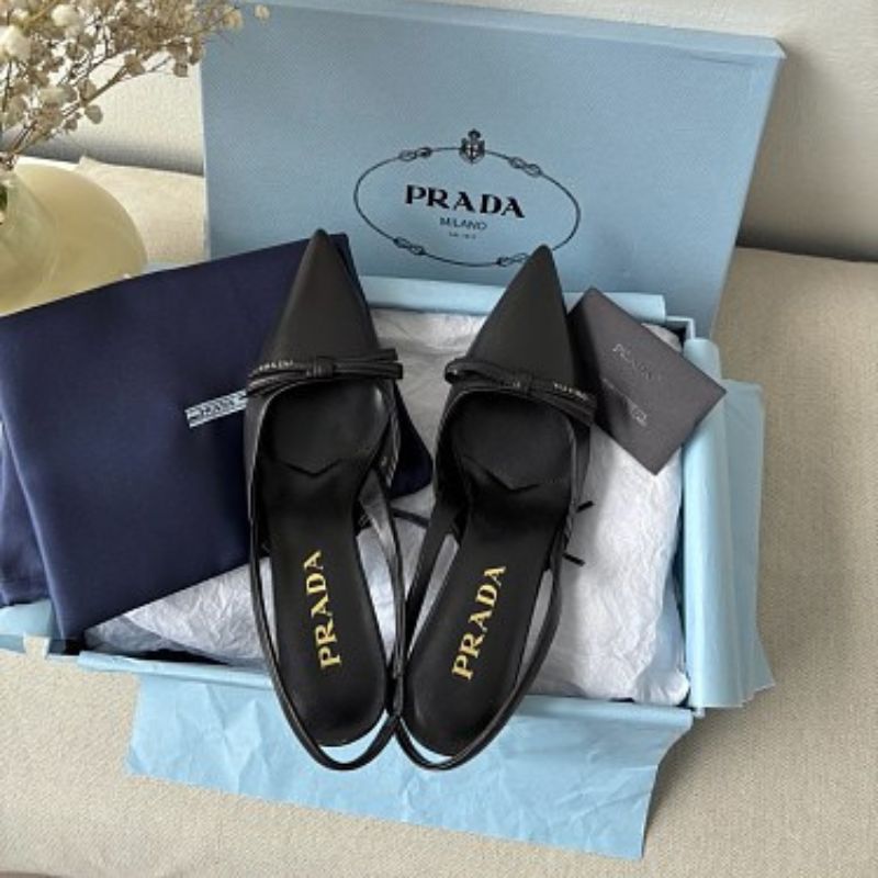 Prada Smooth Leather Bow Slingback Pumps in black.