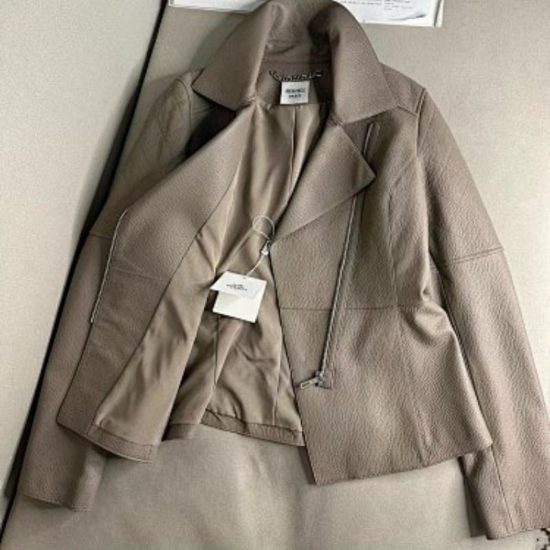 Hermes taupe asymmetrical zip jacket with wide, notched lapels, a cropped fit