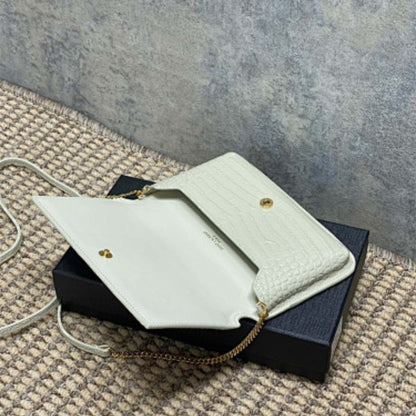 Saint Laurent Cassandre Phone Holder in Shiny Crocodile-Embossed Leather.