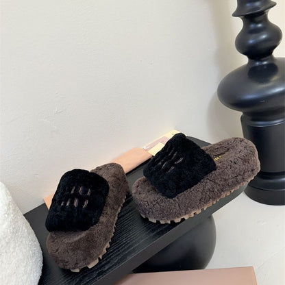 e Miu Miu Shearling logo-embellished Slippers.