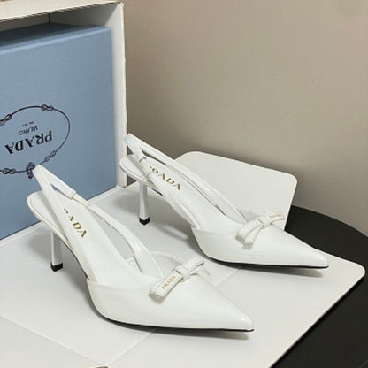 Prada Vernice Patent Leather Bow Slingback Pumps.