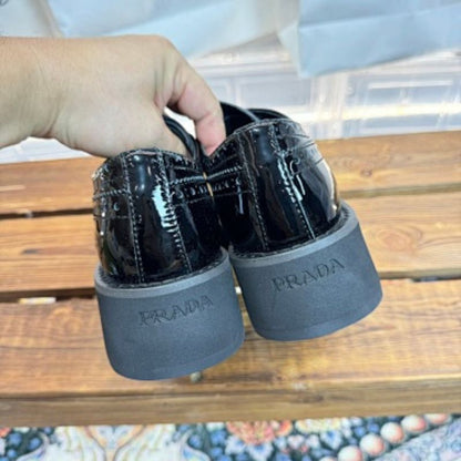 Prada Brushed Leather Brogues with Platform Sole in classic black ("Nero").