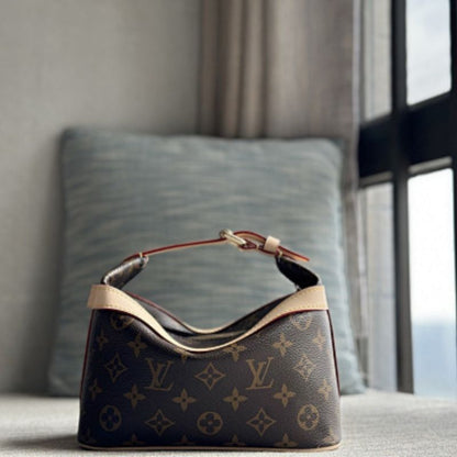 Louis Vuitton Cruiser Toiletry Bag in Monogram coated canvas.