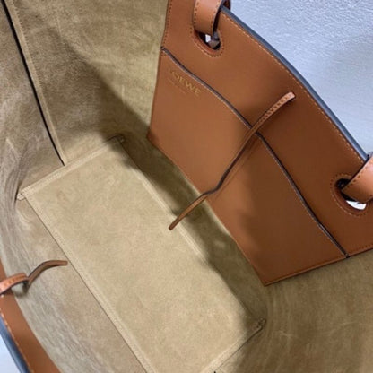 Loewe Anagram Leather Tote with Wicker Handles.