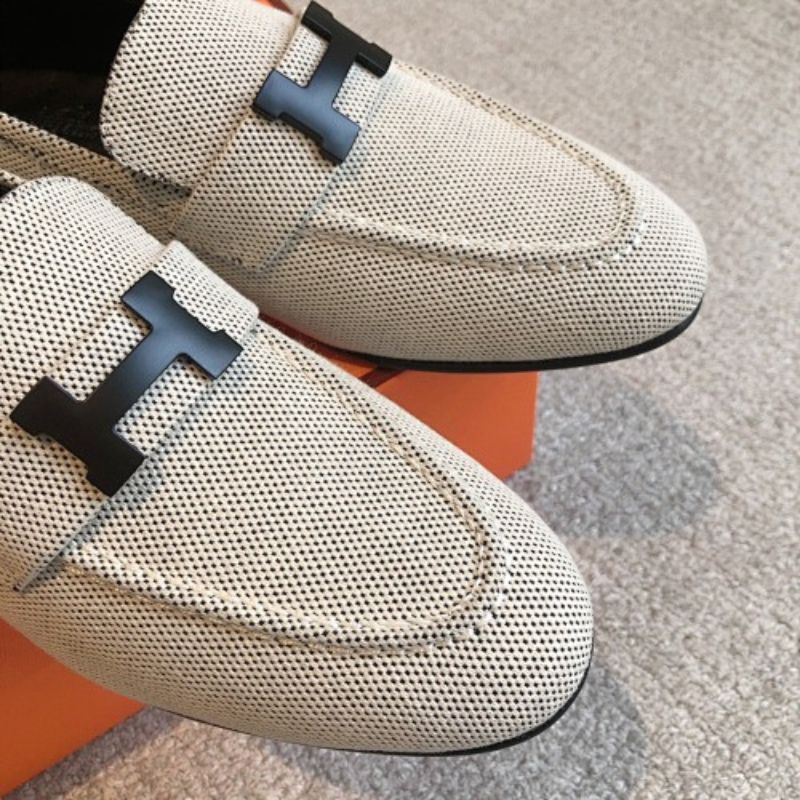 Hermès Paris Loafers in a textured, woven cream fabric finish.