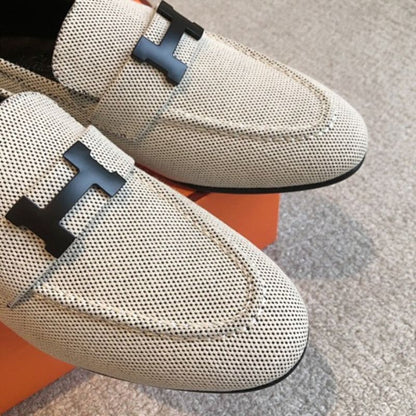 Hermès Paris Loafers in a textured, woven cream fabric finish.