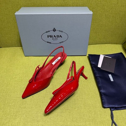 Prada Patent Leather Bow Slingback Pumps in a vibrant red colorway.