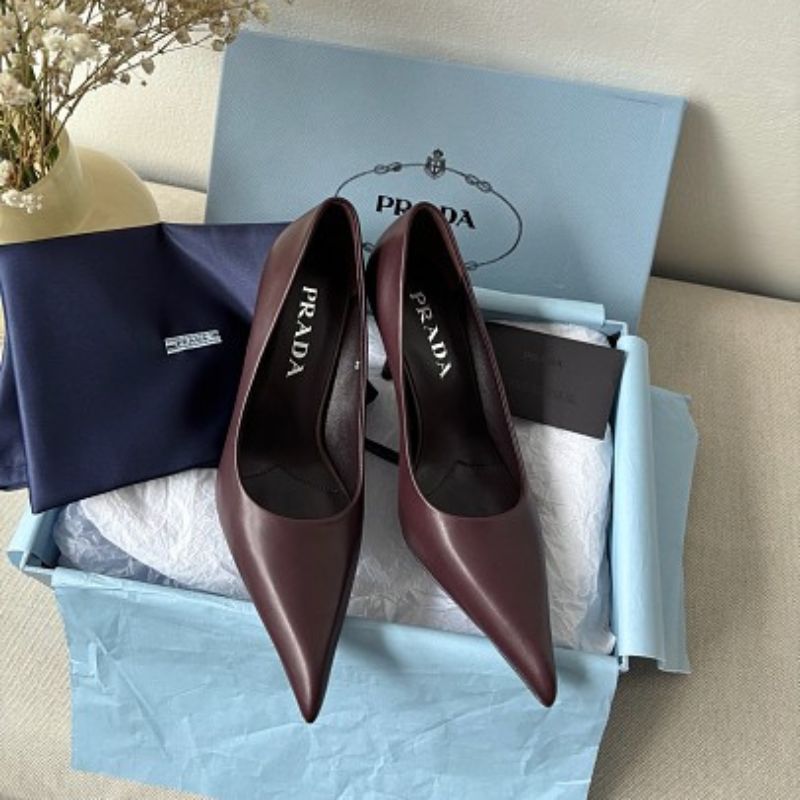 Prada 85mm Pointed-Toe Leather Pumps in a rich burgundy