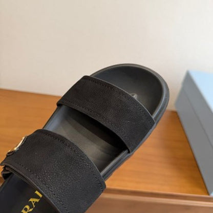 Prada Nubuck Flatform Slides in black.