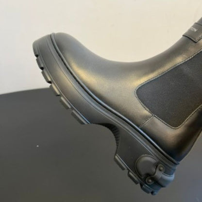 Louis Vuitton LV Squad Chelsea Ankle Boots in black.