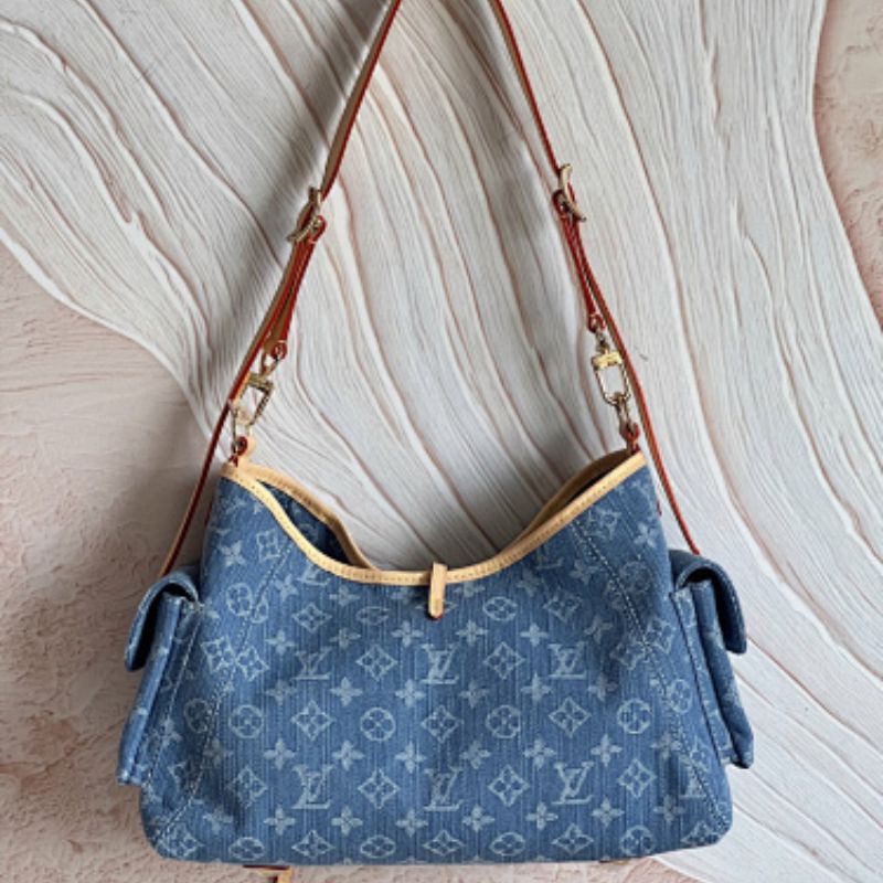 Louis Vuitton's Monogram Carryall Cargo PM Louis Vuitton's Monogram Denim collection.