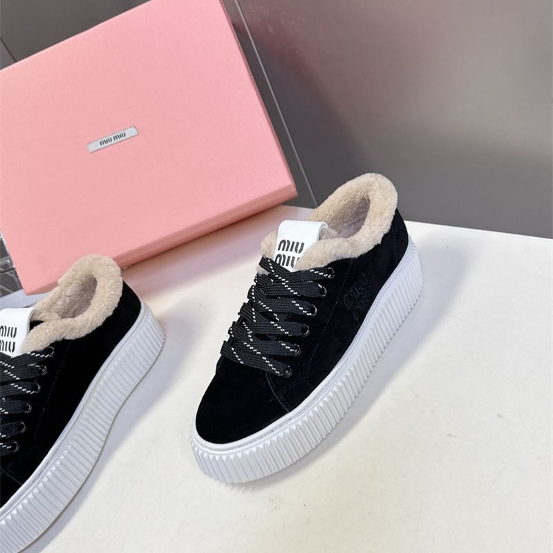 Miu Miu Plume Shearling Sneakers.