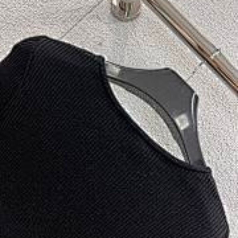 Celine cropped long-sleeved cardigan with metallic buttons.