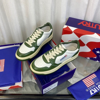 Louis Vuitton Low-Top Sneakers in a white and green