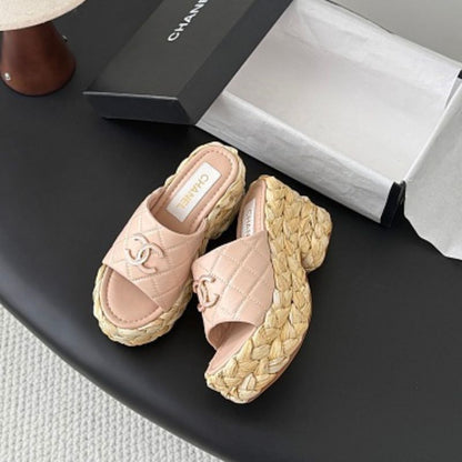 Chanel Quilted Interlocking CC Straw Platform Mules in light pink.