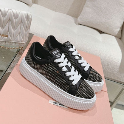 Miu Miu Mesh Flatform Sneakers in black.