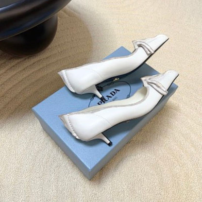 Prada Antiqued Leather Pointed-Toe Flats in the white and tan ("Bianco + Cuoio") colorway.