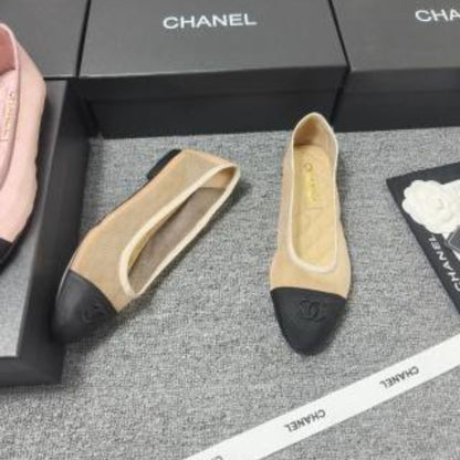 Chanel Ballet Flats in a two-tone beige and black colorway.