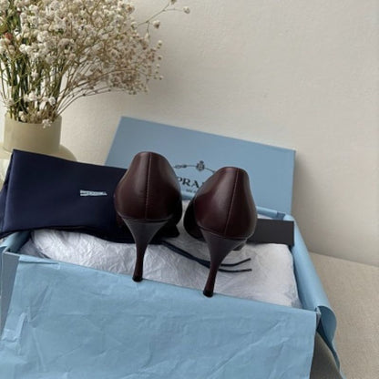 Prada 85mm Pointed-Toe Leather Pumps in a rich burgundy