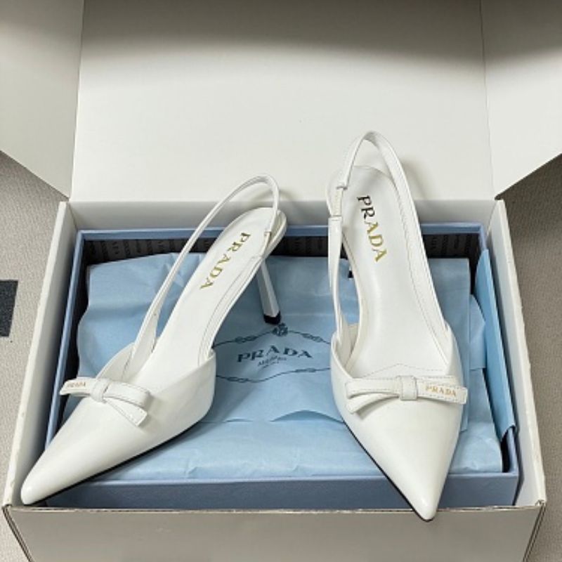 Prada Vernice Patent Leather Bow Slingback Pumps.