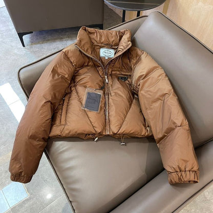 Prada cropped puffer jacket in a brown color