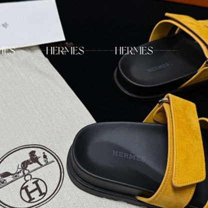 Hermès Chypre Sandals in a vibrant yellow shade,