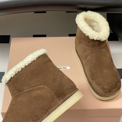 Miu Miu Suede and Shearling Boots.