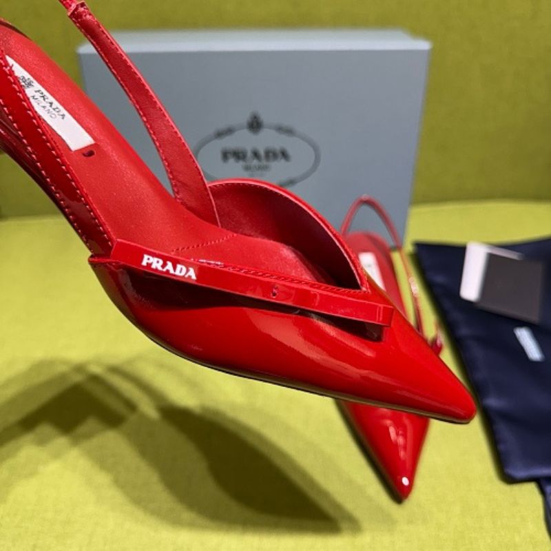 Prada Patent Leather Bow Slingback Pumps in a vibrant red colorway.