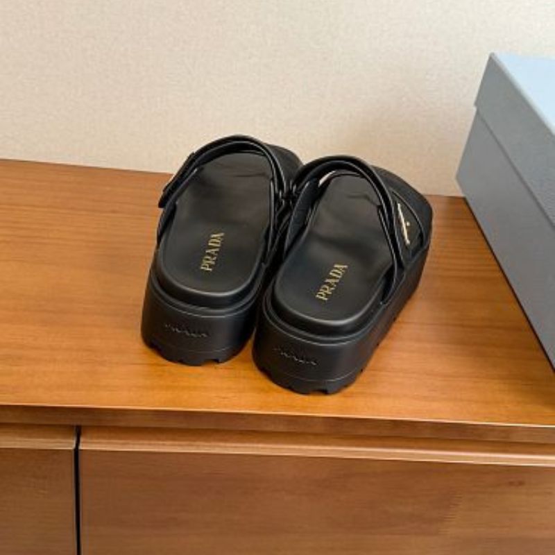 Prada Nubuck Flatform Slides in black.