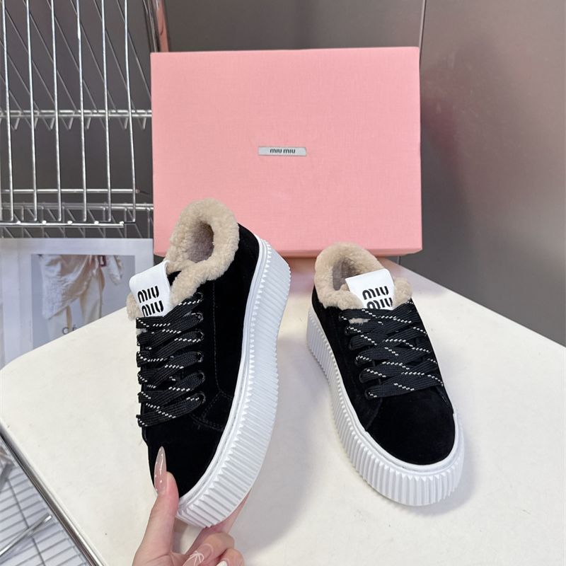 Miu Miu Plume Shearling Sneakers.