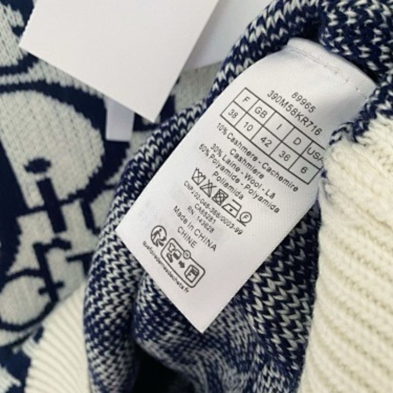 white and navy blue Christian Dior knit top with a white collar