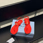 Prada Patent Leather Thong Sandals in a vibrant fiery red ("Fuoco") colorway.
