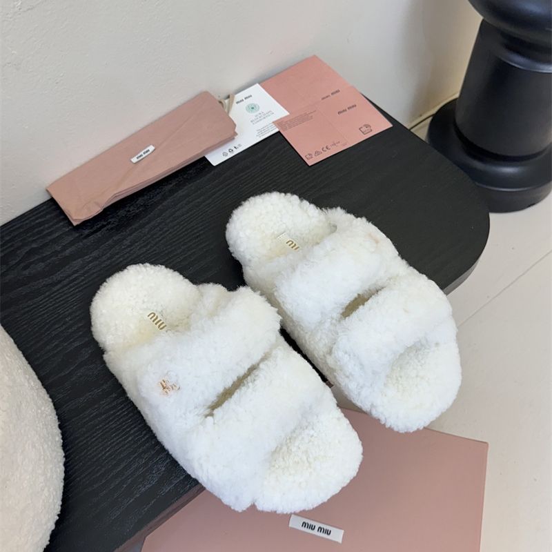 Miu Miu Natural Shearling Slides.
