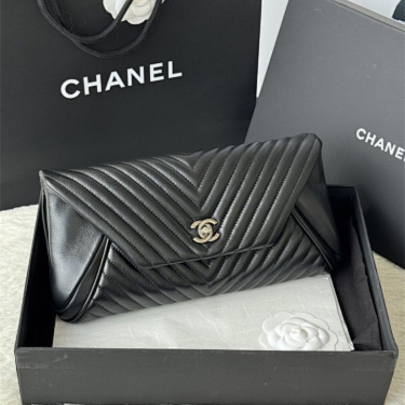 Chanel "Fold Up Again" Chevron Quilted Clutch.