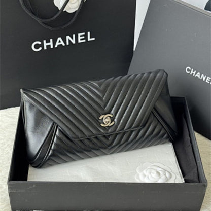 Chanel "Fold Up Again" Chevron Quilted Clutch.