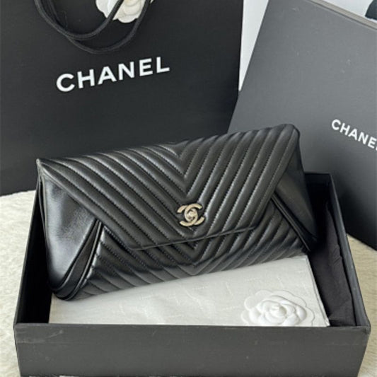 Chanel "Fold Up Again" Chevron Quilted Clutch.