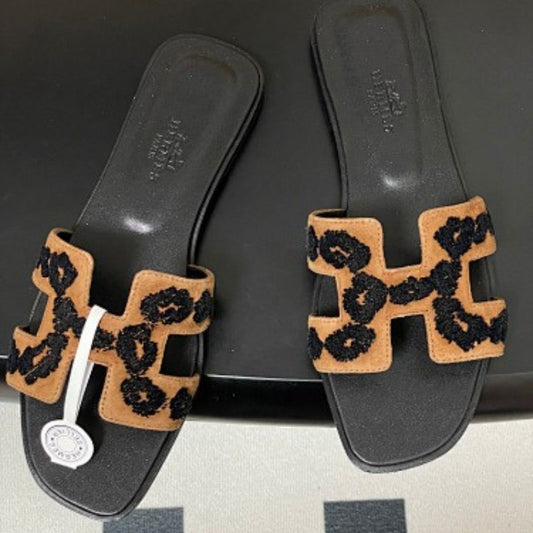 Hermès Oran sandals in a distinctive tricolor leopard-print design