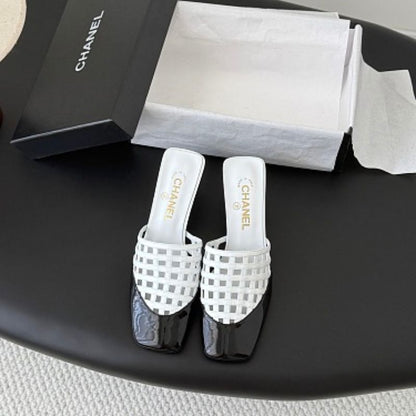 Chanel Interlocking Woven Toe-Cap Mules.