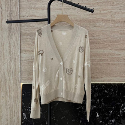 Hermès beige knitted cardigan with whimsical patches,