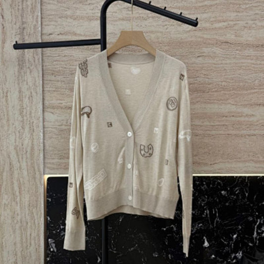 Hermès beige knitted cardigan with whimsical patches,