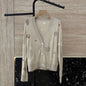 Hermès beige knitted cardigan with whimsical patches,