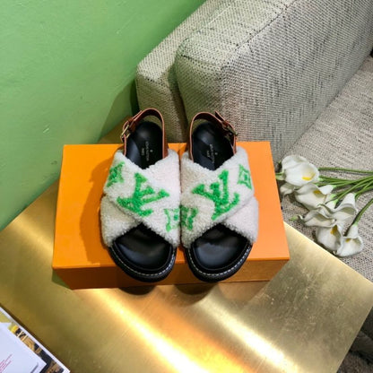 Louis Vuitton Paseo Flat Comfort Sandal with a green logo in shearling