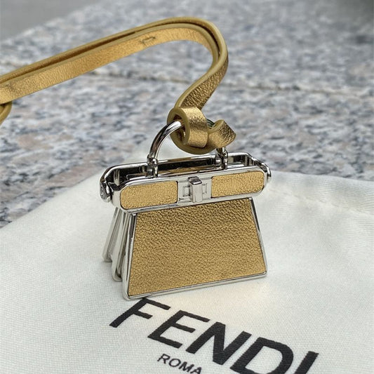 Fendi Pico Peekaboo Charm in a gold/yellow