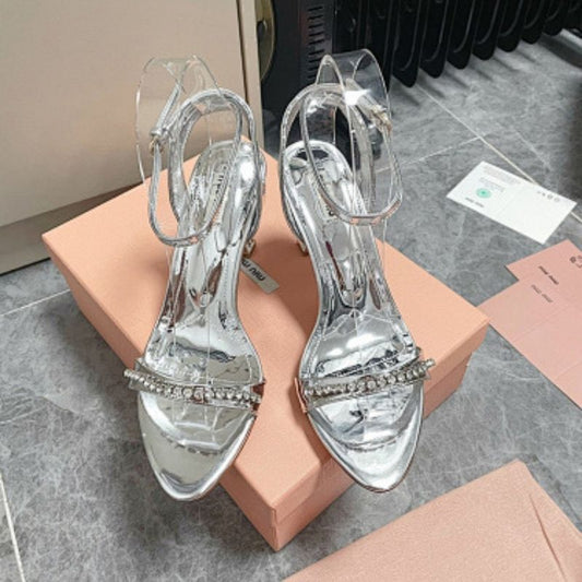 Miu Miu Metallic Leather Sandals with Crystal-Embellished Straps.
