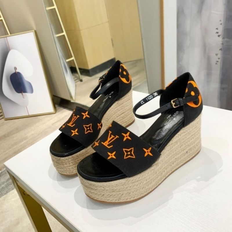 Louis Vuitton Starboard Wedge Sandal in a black and orange
