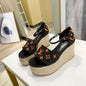 Louis Vuitton Starboard Wedge Sandal in a black and orange