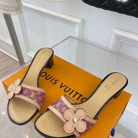 Louis Vuitton mule with a flower detail