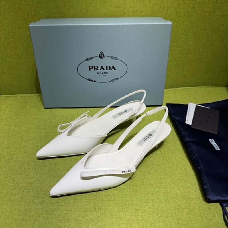 Prada Vernice Patent Leather Bow-Detail Slingback Pumps.