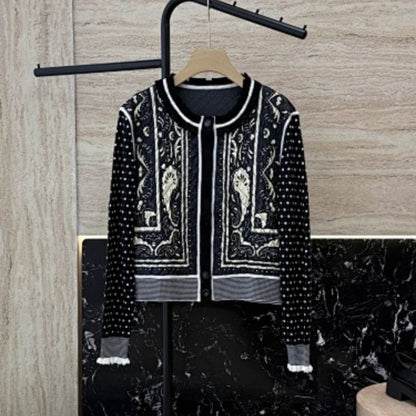 Hermès vintage-style black and white paisley knit cardigan.
